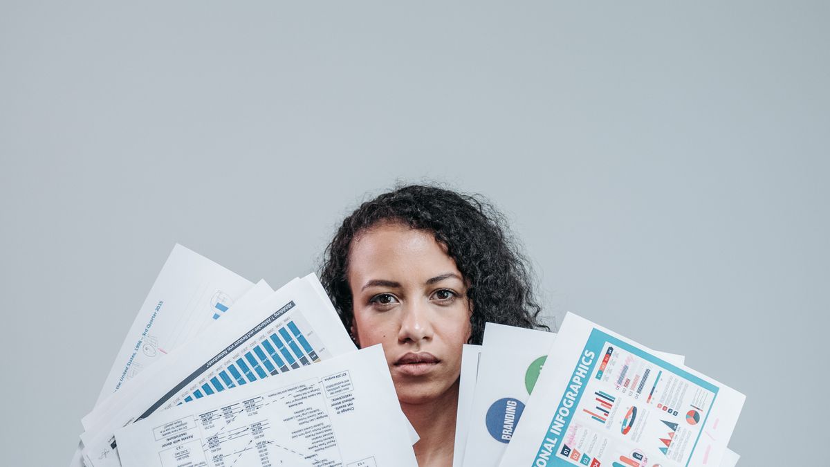 Businesswoman examining charts and graphs
