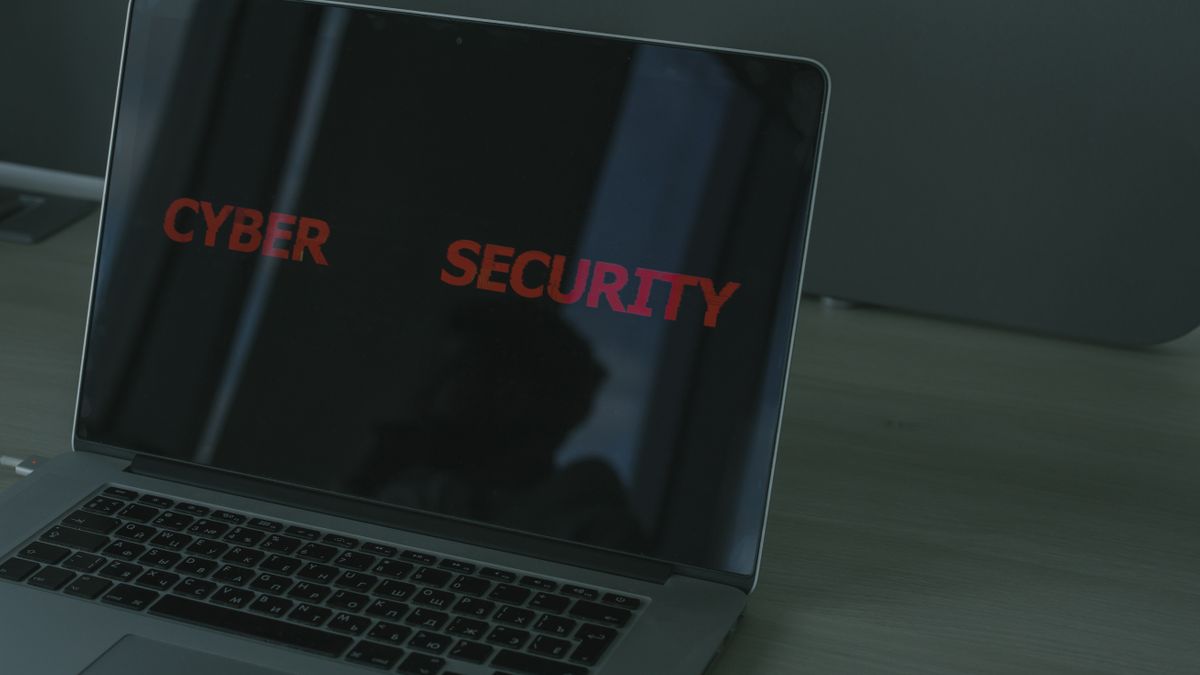 Laptop displaying cybersecurity text