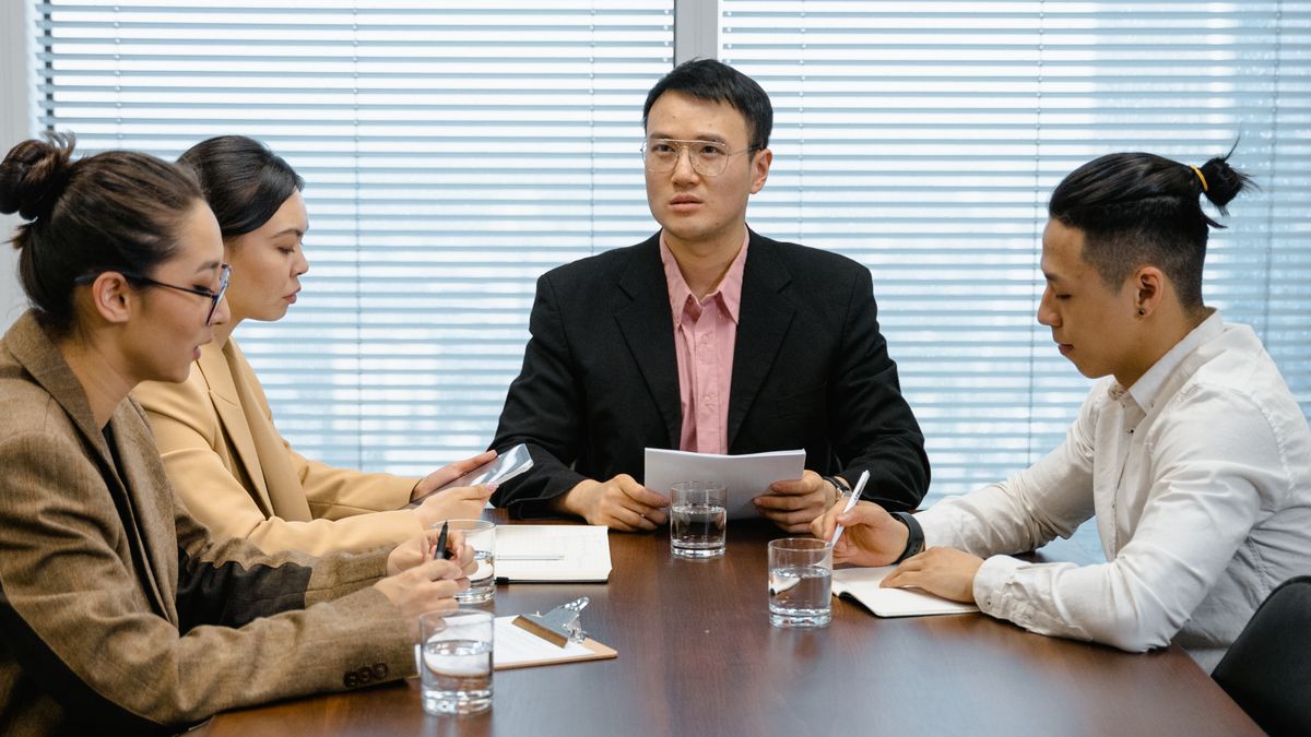 Colleagues in a boardroom business meeting