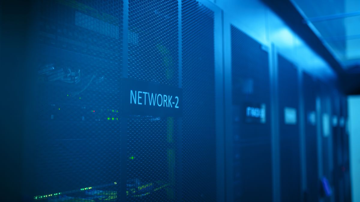 Network rack with blue illumination in a server room