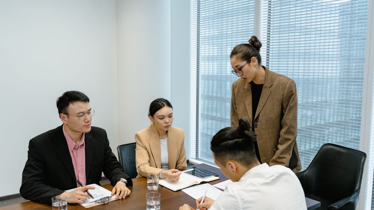 Woman presenting at a team business meeting